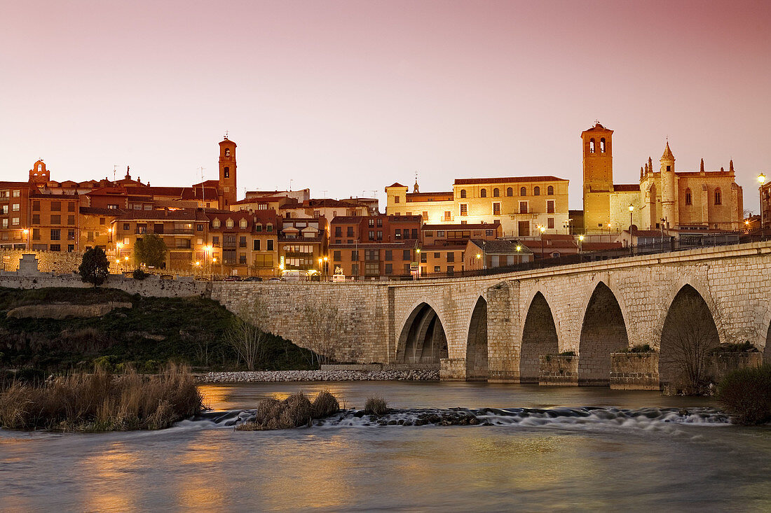 Medieval bridge and Duero river in the evening, Tordesillas. Valladolid province, Castilla-Leon, Spain