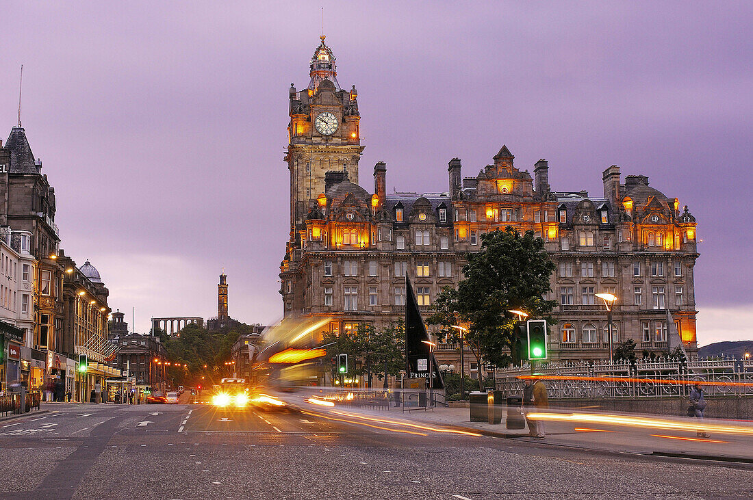Princes Street, Balmoral Hotel and Carlton Hill in background at dusk, Edinburgh. Lothian Region, Scotland, UK