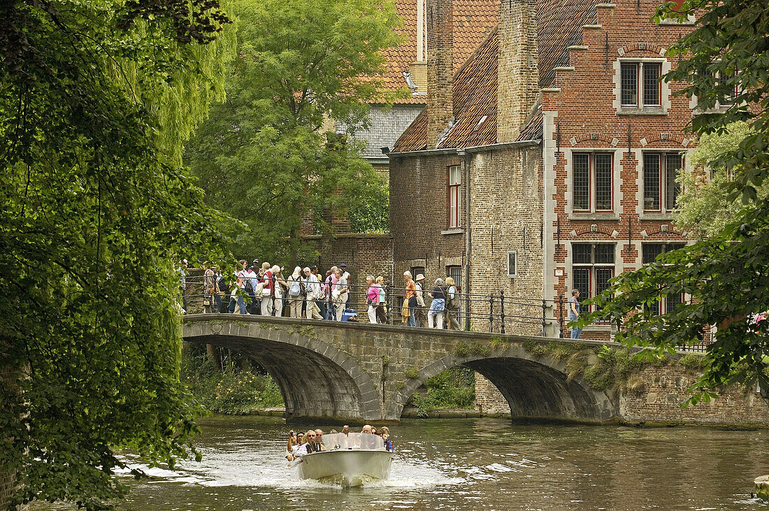 Tourboat on Dijver canal  Brugge, the Venice of the North  Western Flanders  Belgium