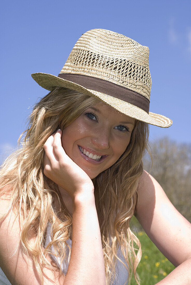 Beautiful young woman enjoying being outside in early spring sunshine