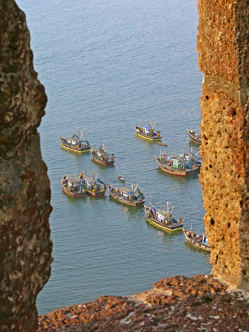 Colorful Fishing boats in sea water, View from Bhagwati fort  Bhagwati harbor, Ratnagiri, Maharashtra, India