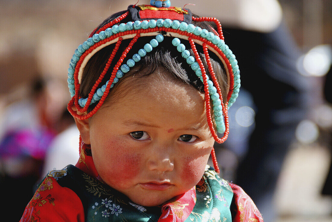 Tibetan little girl in Thangka festival