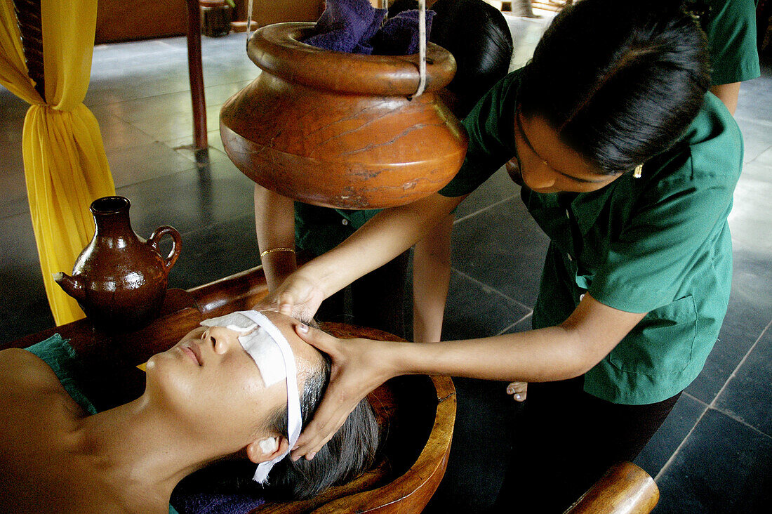 Saligao Goa, India, a woman receiving an ayurvedic massage with oil at the Ayurvedic Natural Health Centre