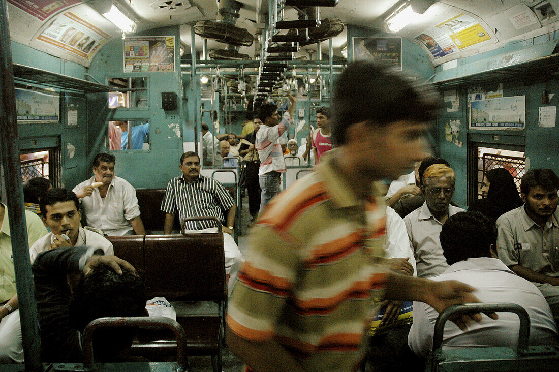 Mumbai India, passengers in a train at Victoria station