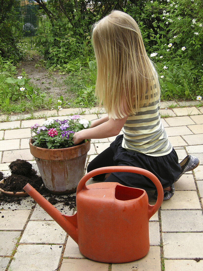 Young girl doing gardening.