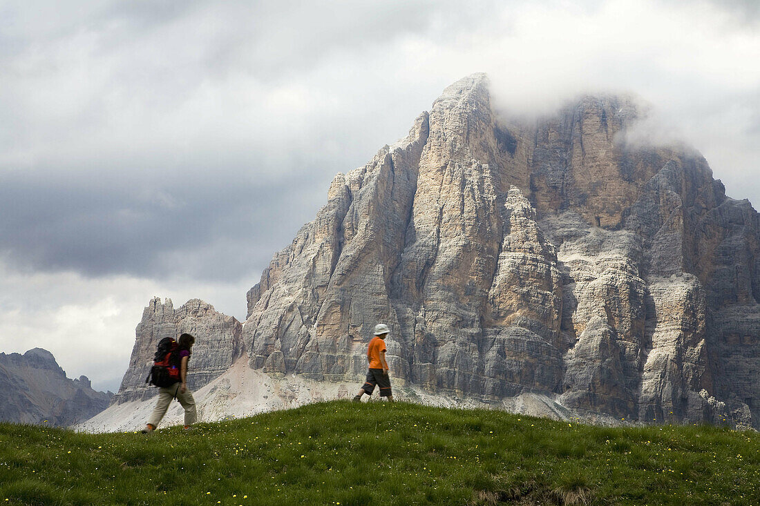 Hikers in the Five Torri, Dolomites, Italian Alps. Italy. Europe.