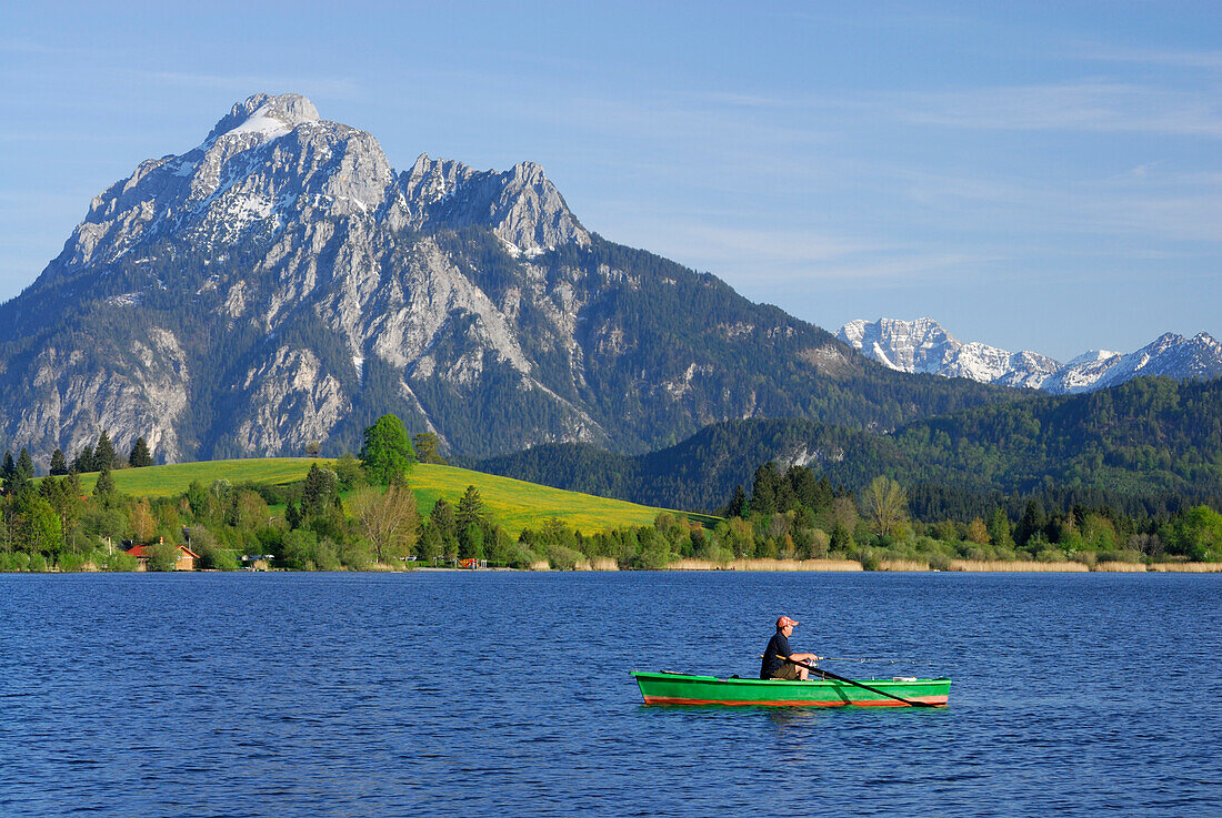 Rowboat on lake Hopfensee with mount Saeuling in background, Allgaeu, Swabia, Bavaria, Germany
