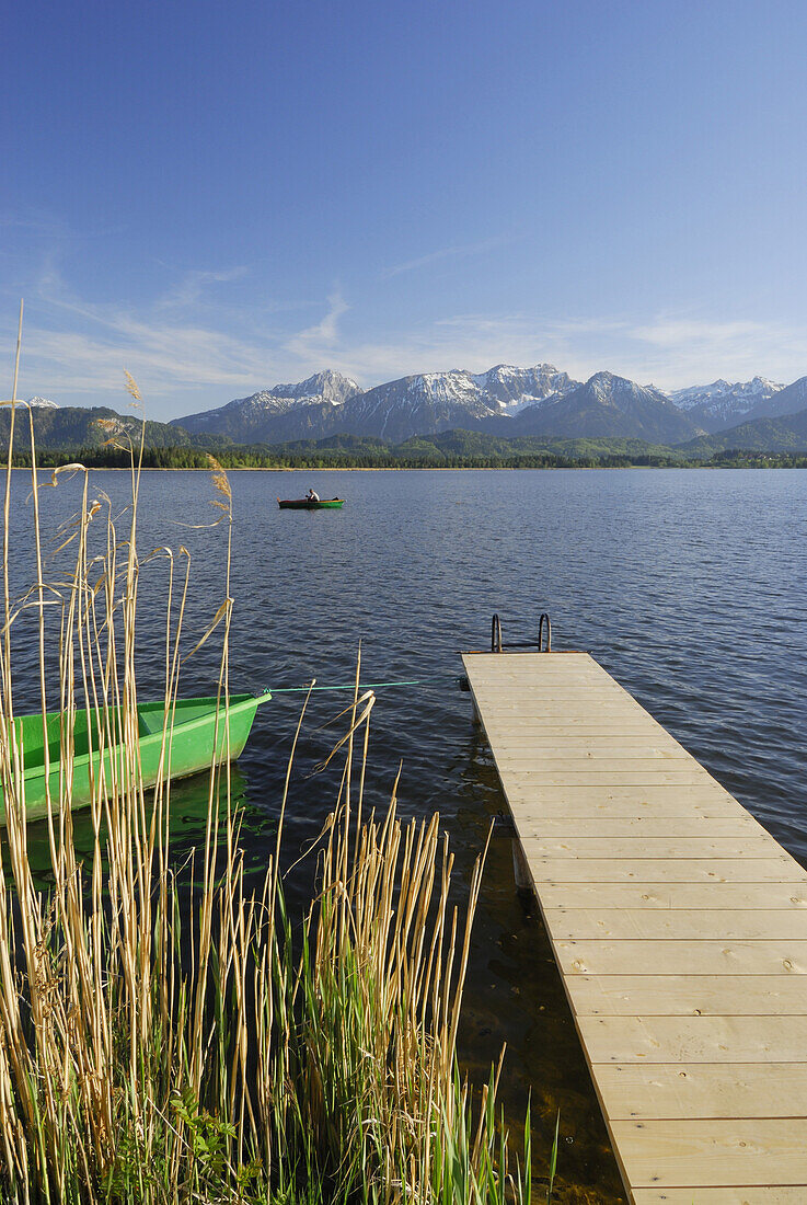 Jetty at lake Hopfensee with Tannheim range in background, Allgaeu, Swabia, Bavaria, Germany