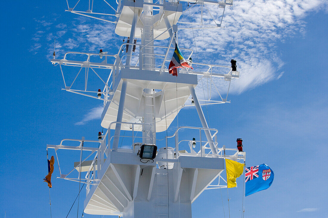 Fijian Flag on cruiseship MV Columbus under blue sky, Fiji Islands, South Pacific, Oceania