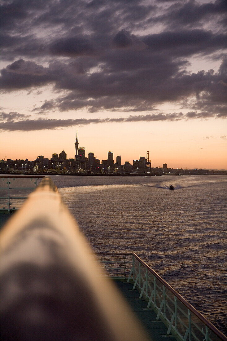 Railing of cruiseship MV Columbus and skyline at sunset, Auckland, North Island, New Zealand, Oceania