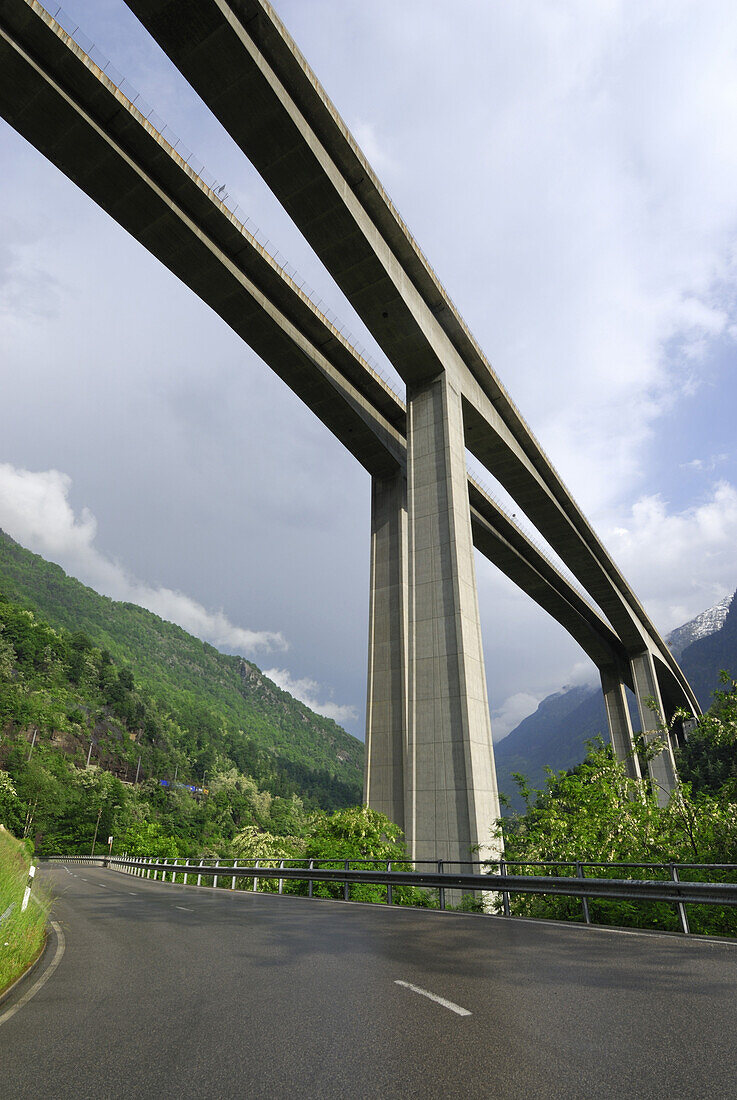 Road passing beneath highway bridge, Gotthard highway near Giornico, valley Leventina, Ticino, Switzerland