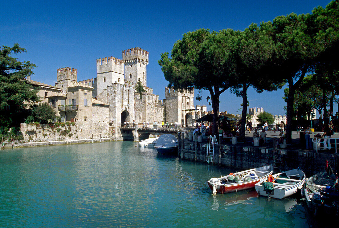 Scaliger castle at the harbour under blue sky, Sirmione, Lake Garda, Lombardy, Italy, Europe