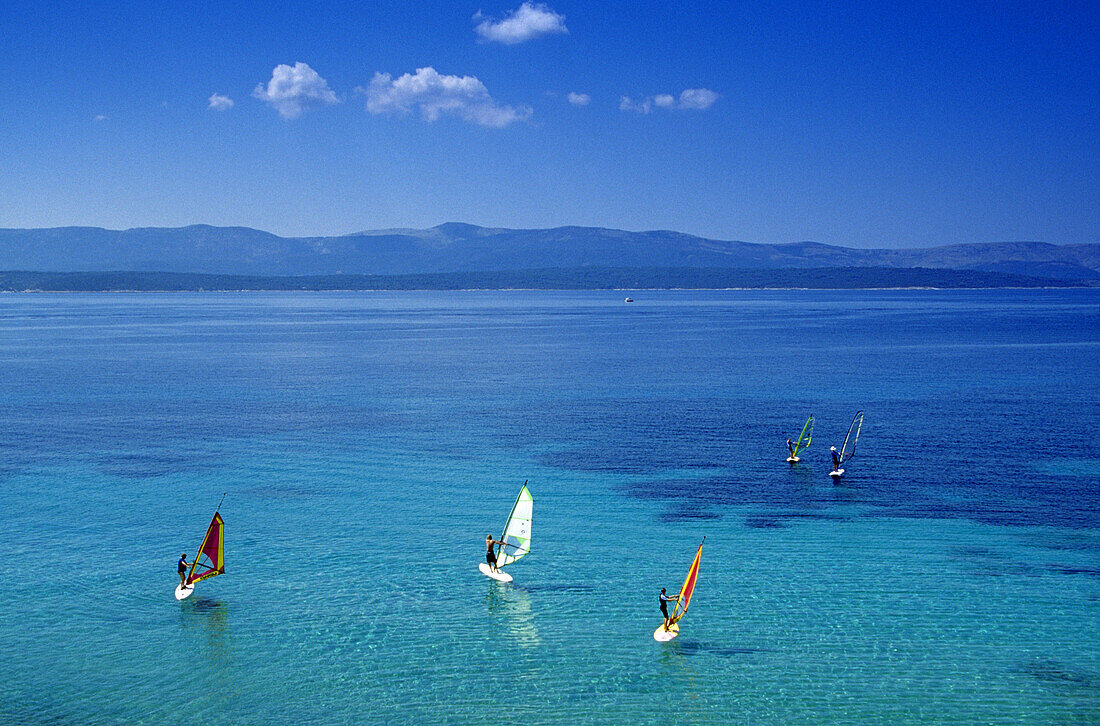 Sail boarders at Golden Horn in the sunlight, Brac island, Croatian Adriatic Sea, Dalmatia, Croatia, Europe