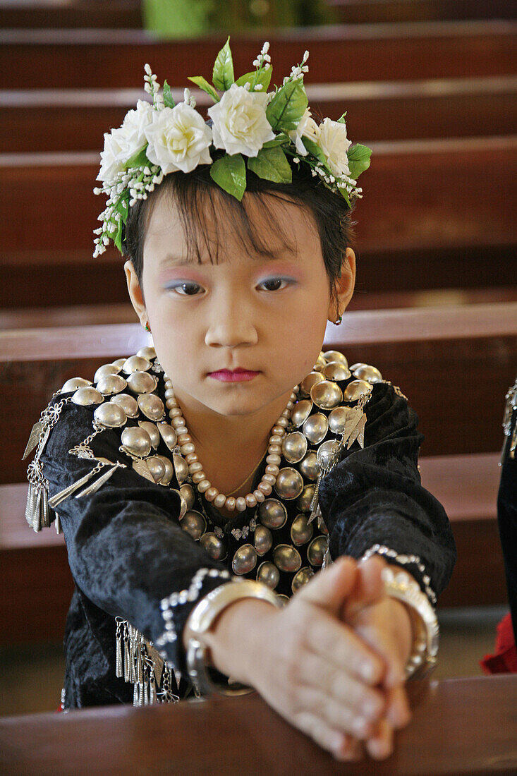 Myanmar  Girl at mass of  Catholic wedding of tribal Kachins at  Myitkyina, a largely Kachin community in north Burma near the Chinese border