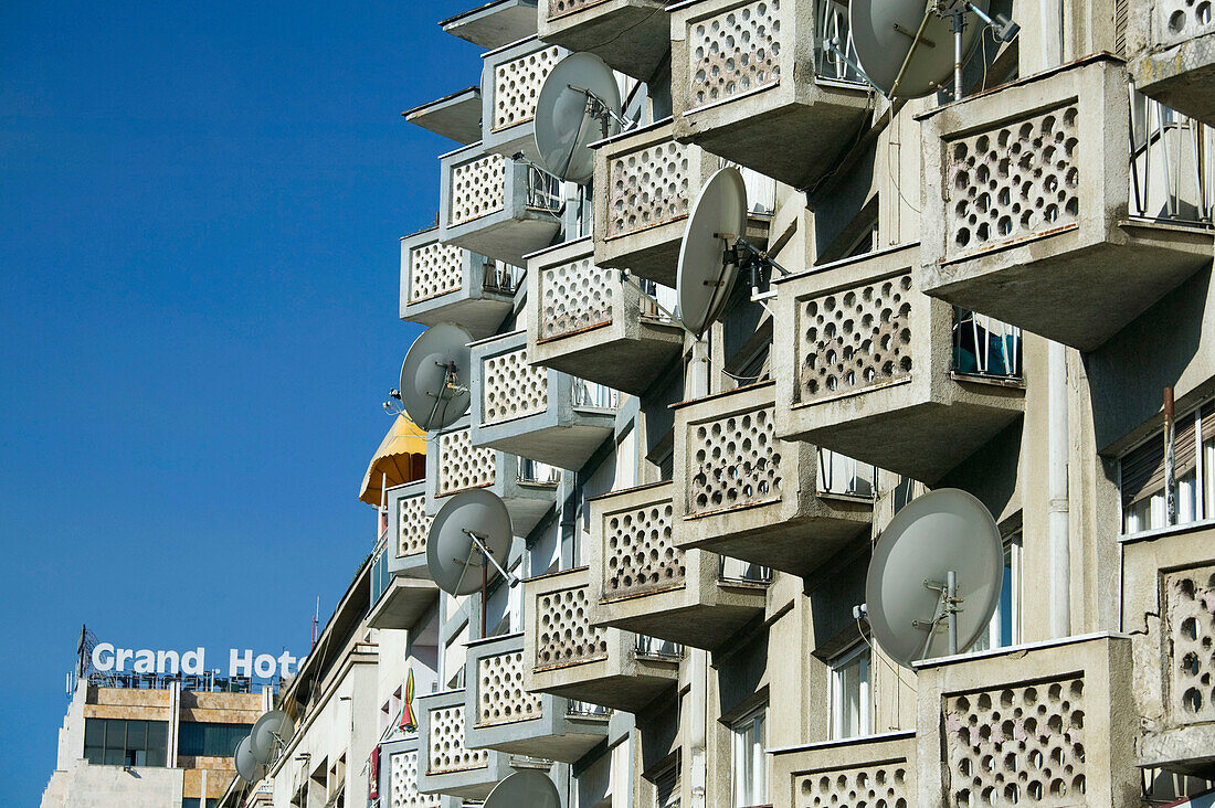 Kosovo. Prishtina. Satellite dishes on apartment house