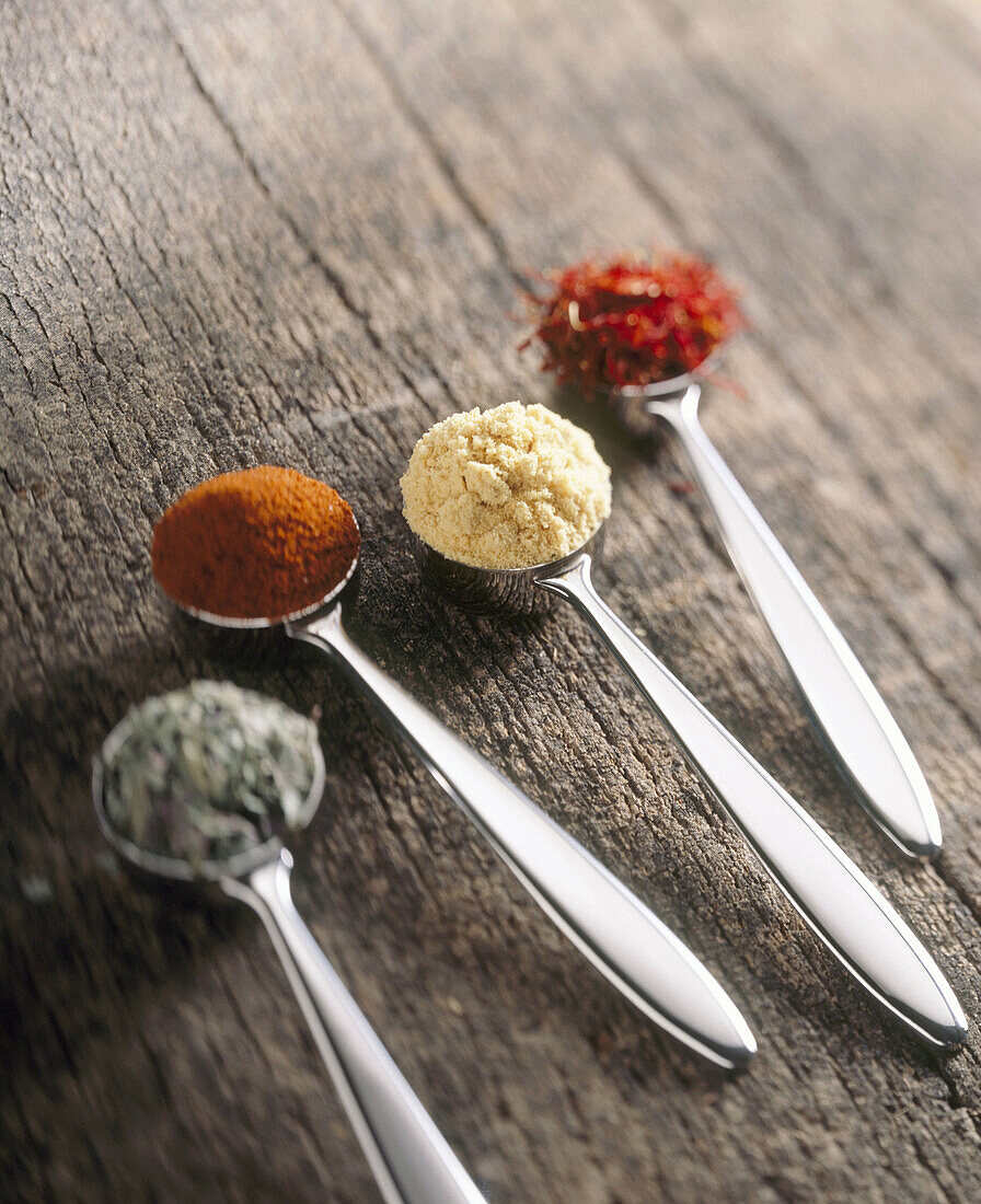 Spices: (left to right) oregano, paprika, curry and saffron