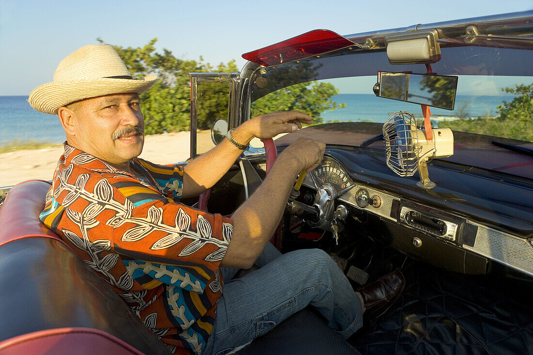 Man in 1950 Chevrolet convertible, Cuba