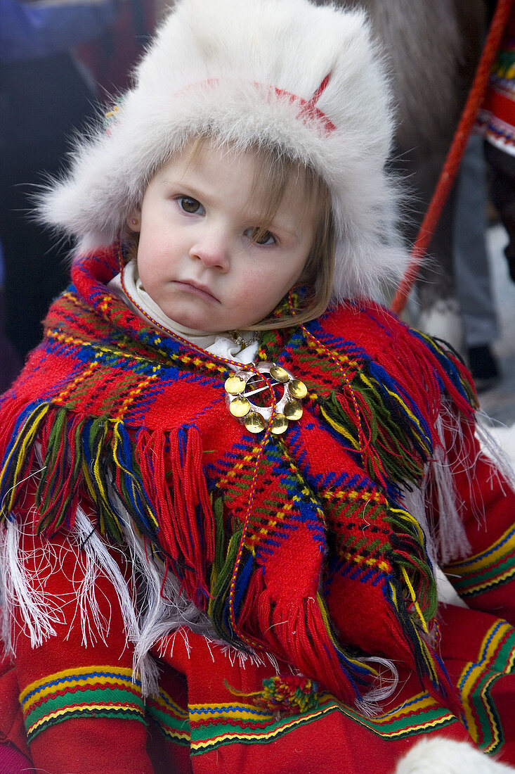 Young Sami (Lapp) girl in traditional clothes. Jokkmokk, Northern Sweden