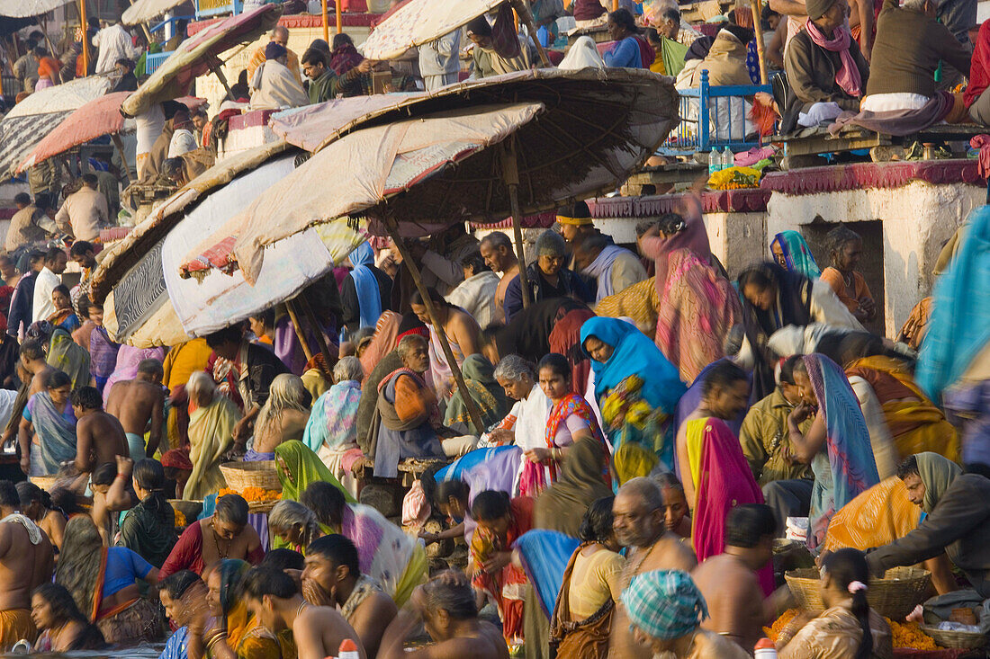 Pilgrims bathing in holy river Ganges