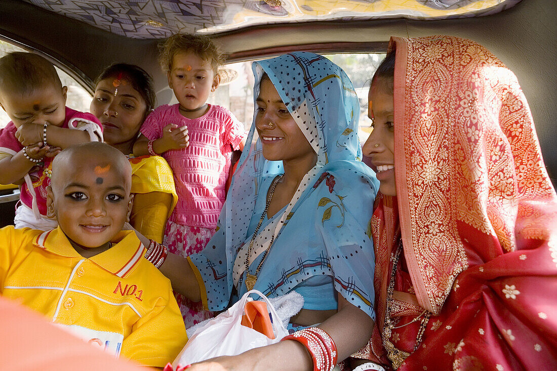 Indian family in back of taxi, Kolkatta (Calcutta). West Bengal, India