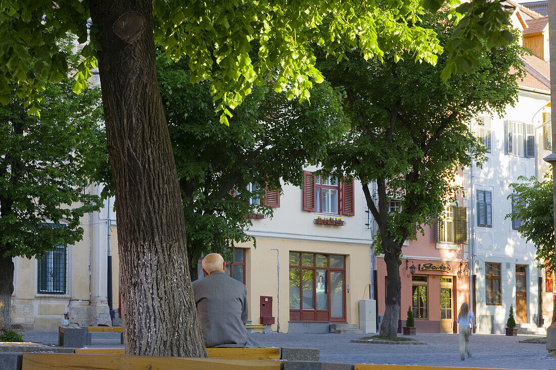 Man and child in square, Sibiu, Transylvania, Romania