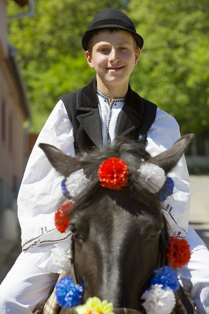 Man in traditional costume on horse near Sibiu, Transylvania, Romania