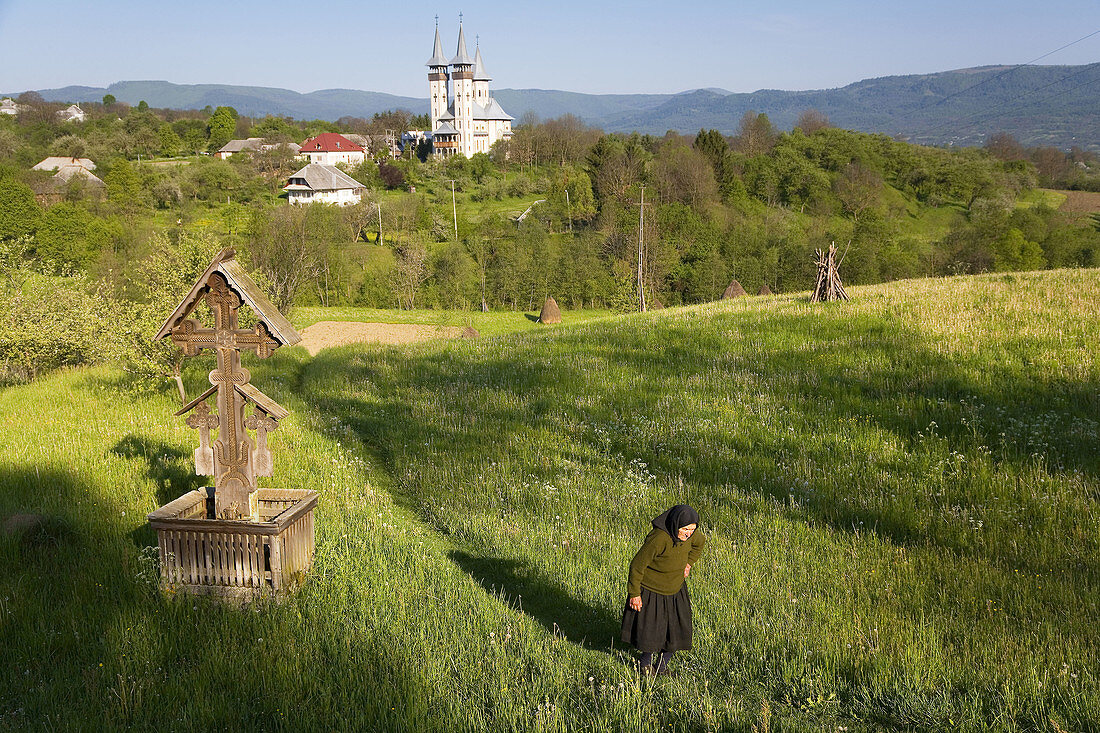 Women walking out of village, Breb, Maramures, Romania