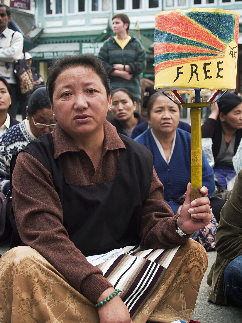 free sign on a prayer wheel at Tibetan protest rally against Chinese