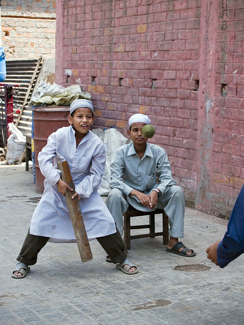 Moslem boys playing cricket in the streets of Calcutta