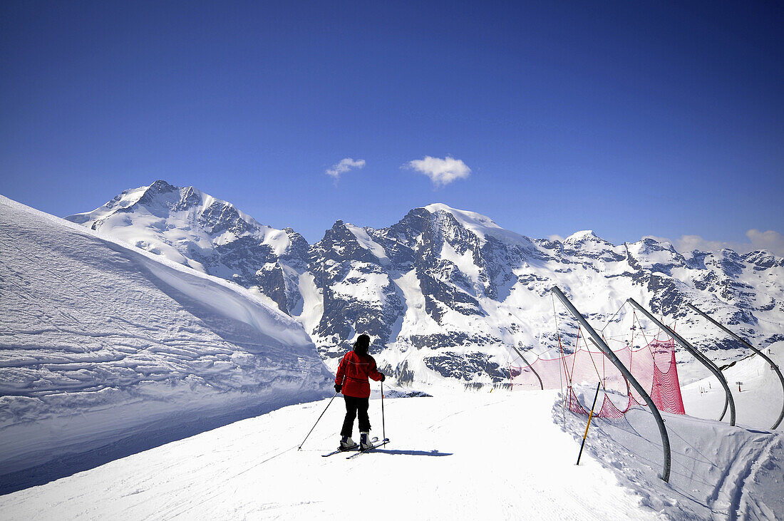 Skier with Bernina range, Diavolezza, Pontresina, Upper Engadin, Grisons, Switzerland
