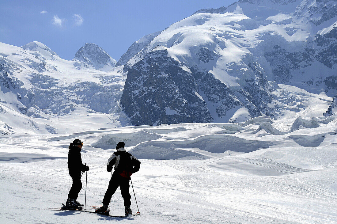 Two skiers, Morteratsch valley, Bernina range, Engadin, Grisons, Switzerland