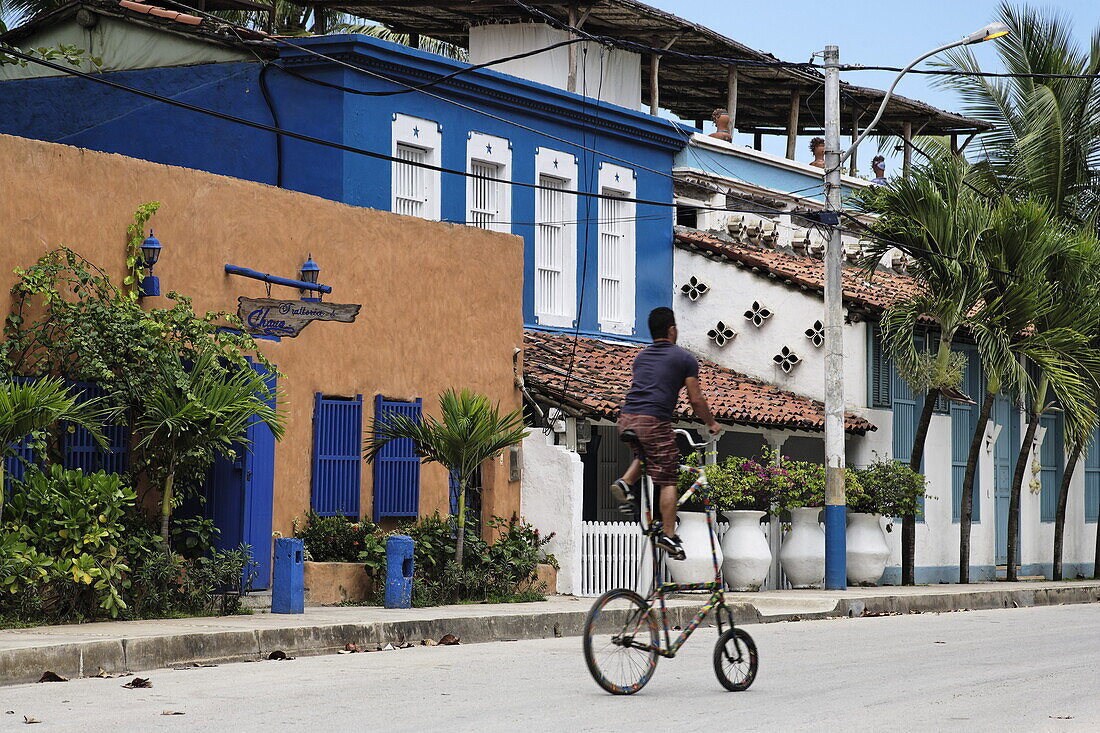 Man riding a curious bicycle, Playa El Tirano, Isla de Margarita, Nueva Esparta, Venezuela