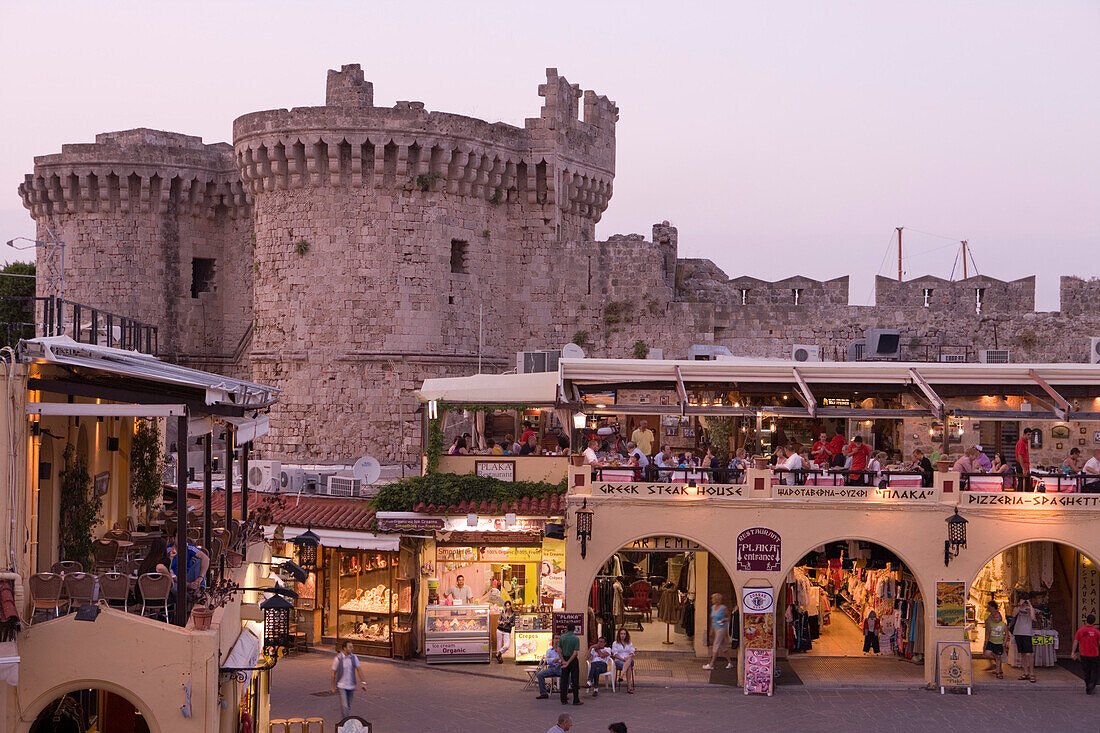 Restaurants and fortification at the Old Town at dusk, Rhodes city, Rhodes, Greece, Europe