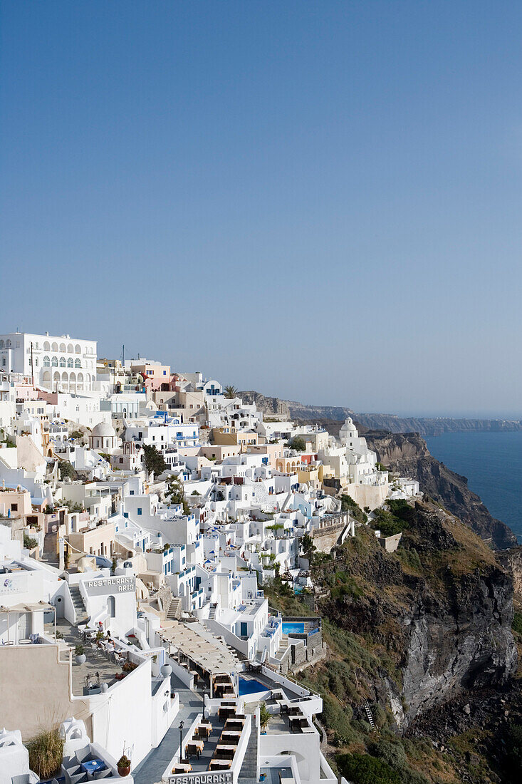 Houses at a mountainside in the sunlight, Fira, Santorini, Greece, Europe
