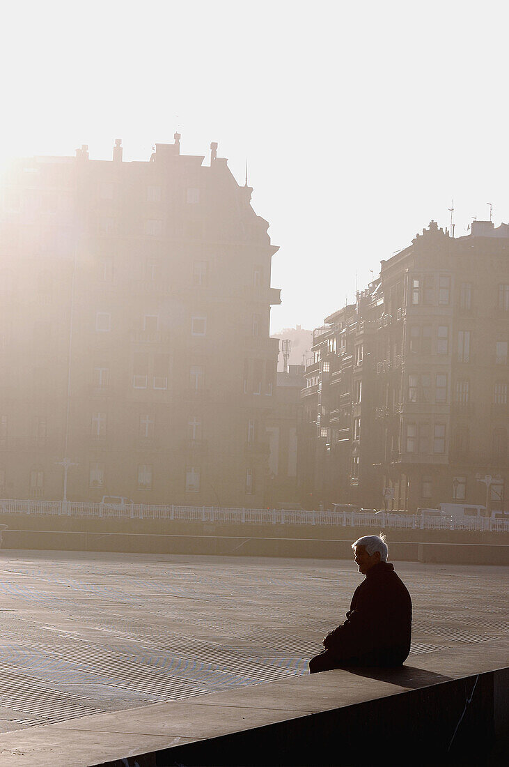 Old woman. 'La Concha' beach in San Sebastian, Euskadi, Spain.