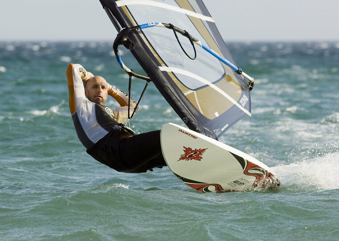 Ability, Action, Adult, Board, Equipment, Exciting, Male, Man, Ocean, Sail, Sail boarding, Sailboarding, Sailing, Sea, Sport, Wetsuit, Windsurf, Windsurfer, Windsurfing, A75-807073, agefotostock 