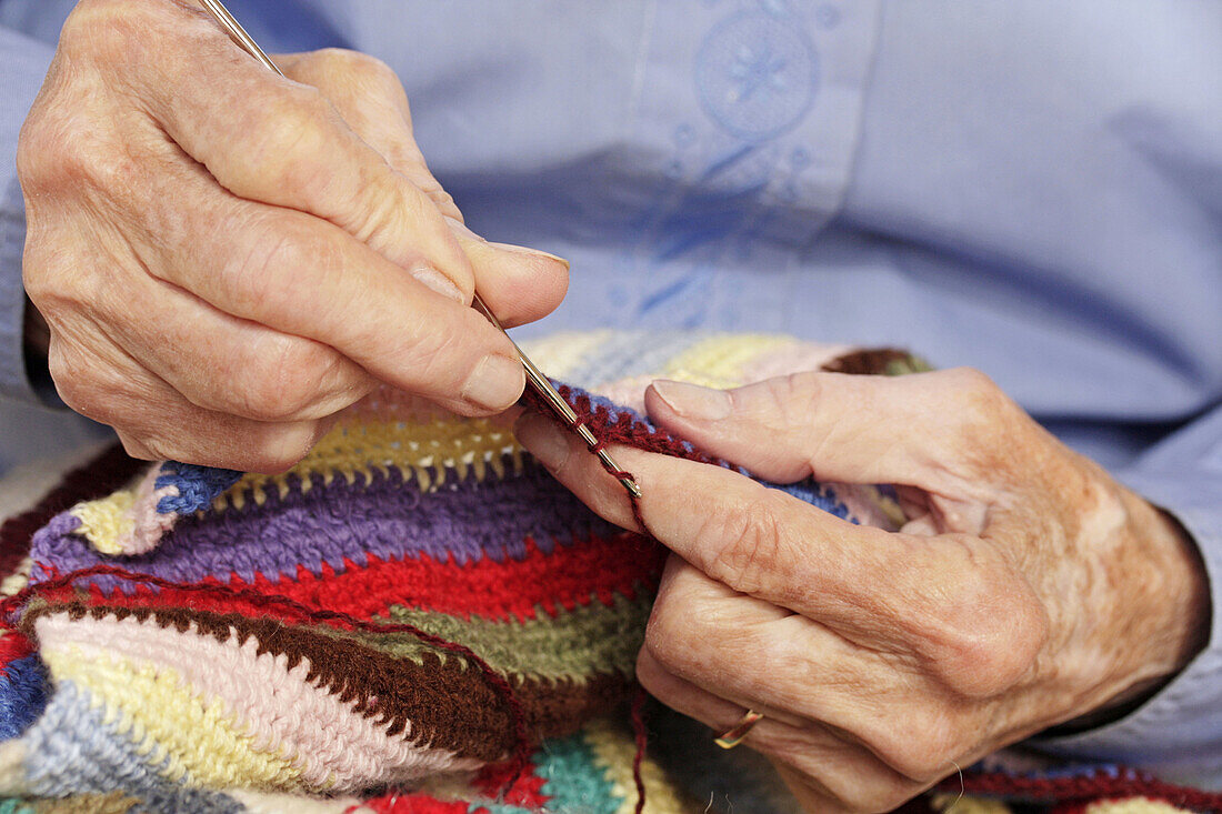 Old woman crocheting