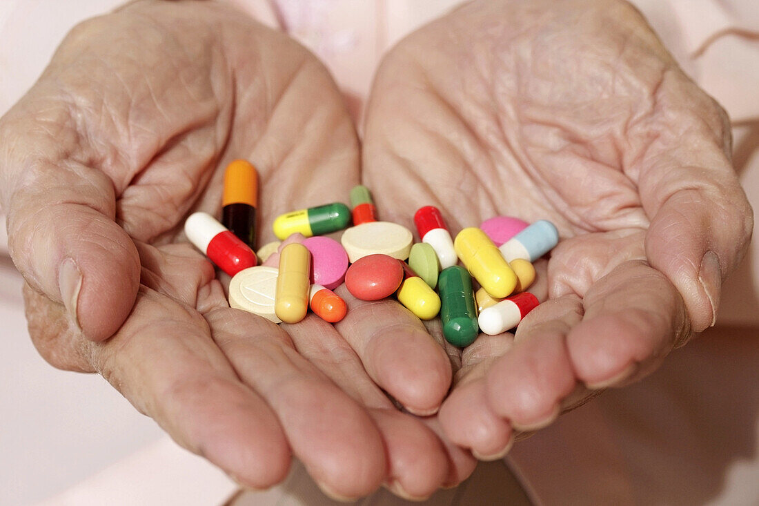 Old woman and pills