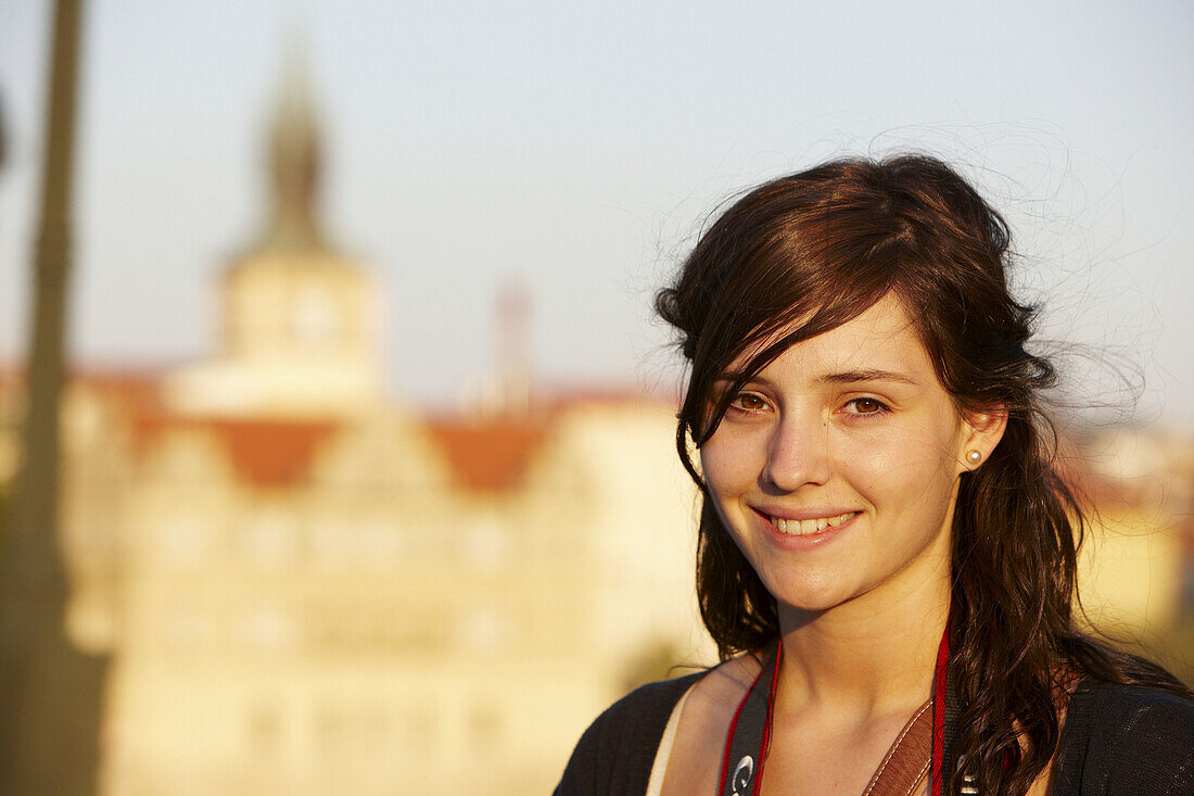 20 year old woman at Charles Bridge, Prague, Czech Republic
