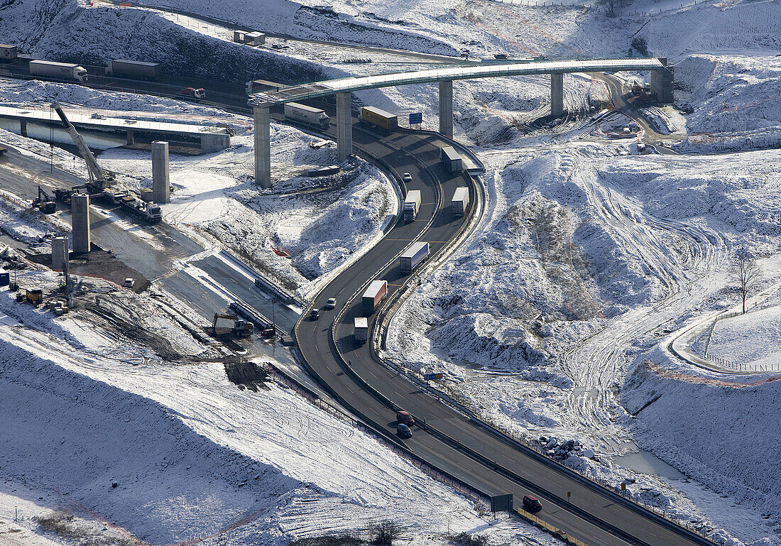Fly-over under construction,  A8 freeway with snow,  Autopista del Cantábrico,  Pasaia. Guipuzcoa,  Basque Country,  Spain