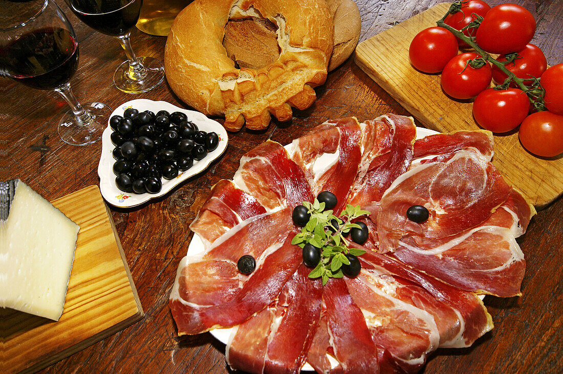 Spain. Andalusia. Malaga. Food: olives,  wine,  cheese,  ham,  bread,  tomatoes.