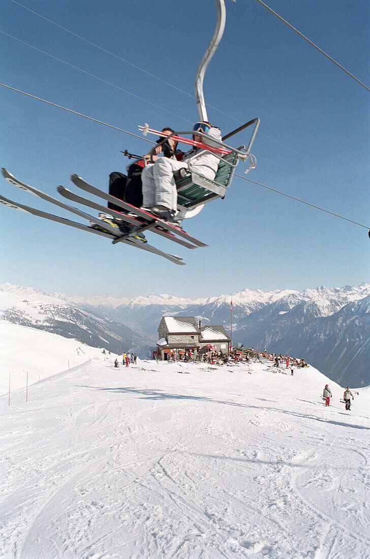 Chairlift with skier, Skiing, Ski slope, Winter, Crans Montana, Switzerland