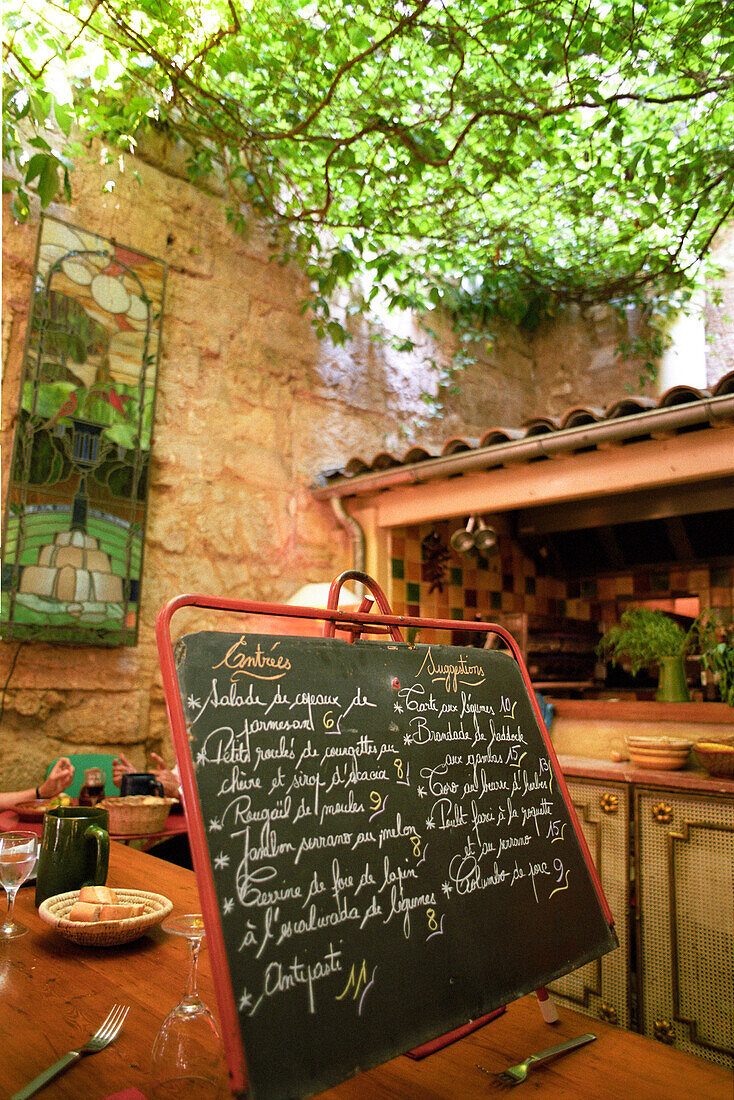 Menu written on a blackboard on the patio of a restaurant, Collioure, Languedoc-Roussillon, South France, France