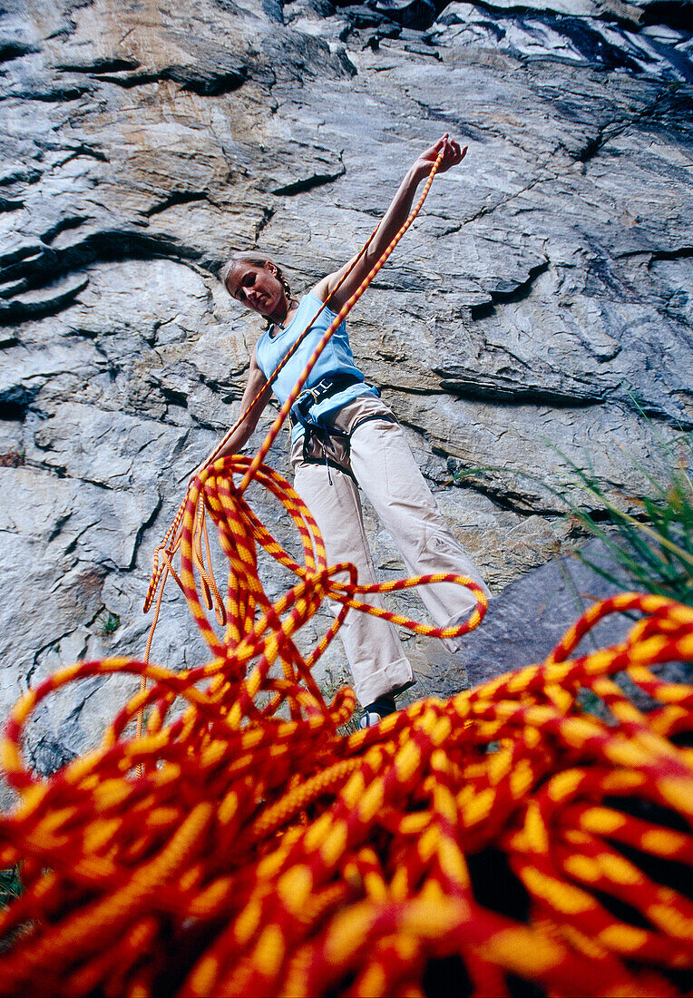 View at woman with climbing rope, Ticino, Switzerland, Europe
