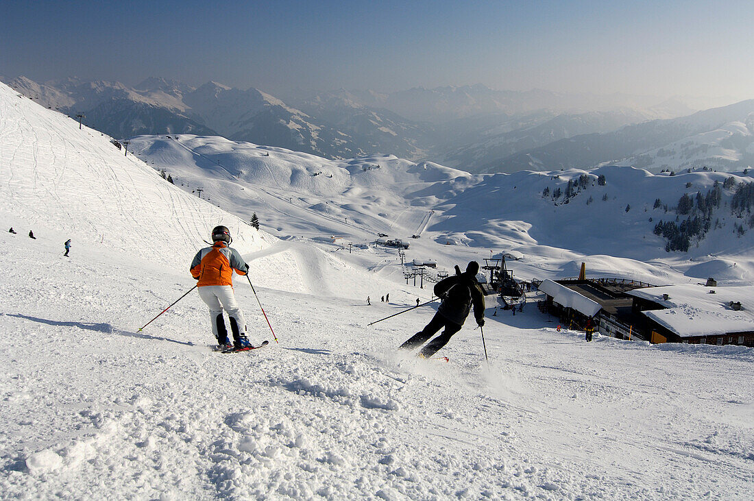 Skiers on a ski slope at Kitzbuehel Alps, Tyrol, Austria, Europe