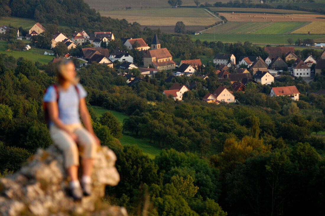 Woman on a mountain looking at the view, Walberla, Bavaria, Germany, Europe