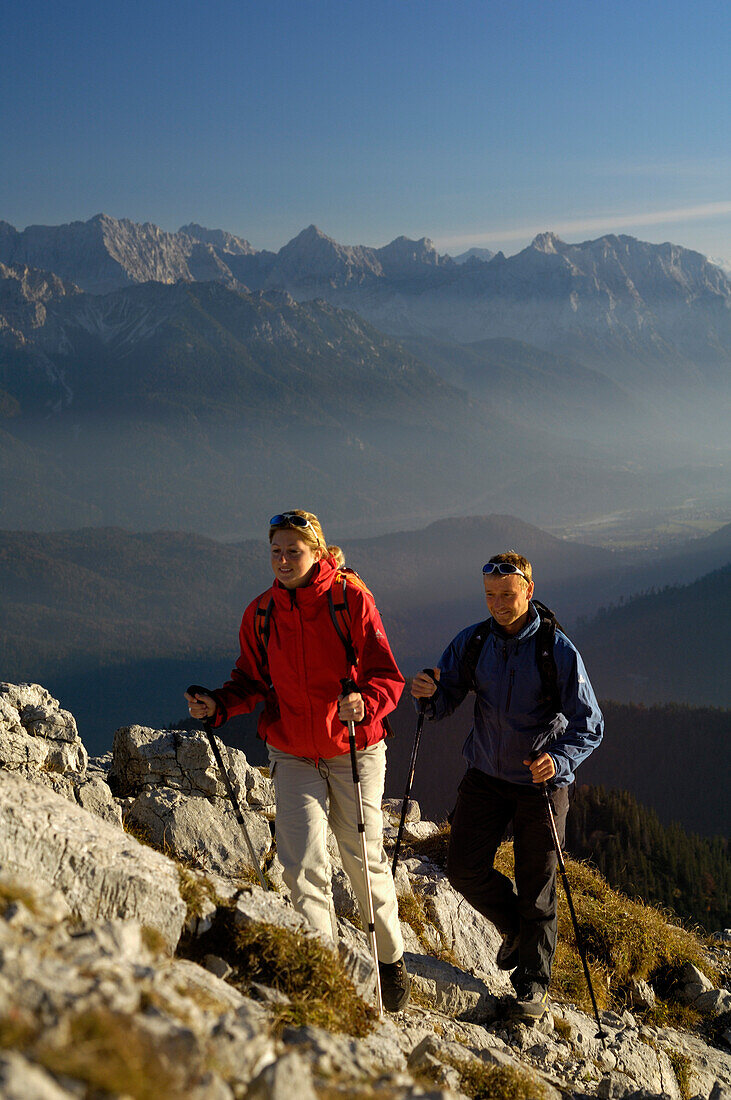 Couple on a hiking tour at heimgarten, Upper Bavaria, Bavaria, Germany