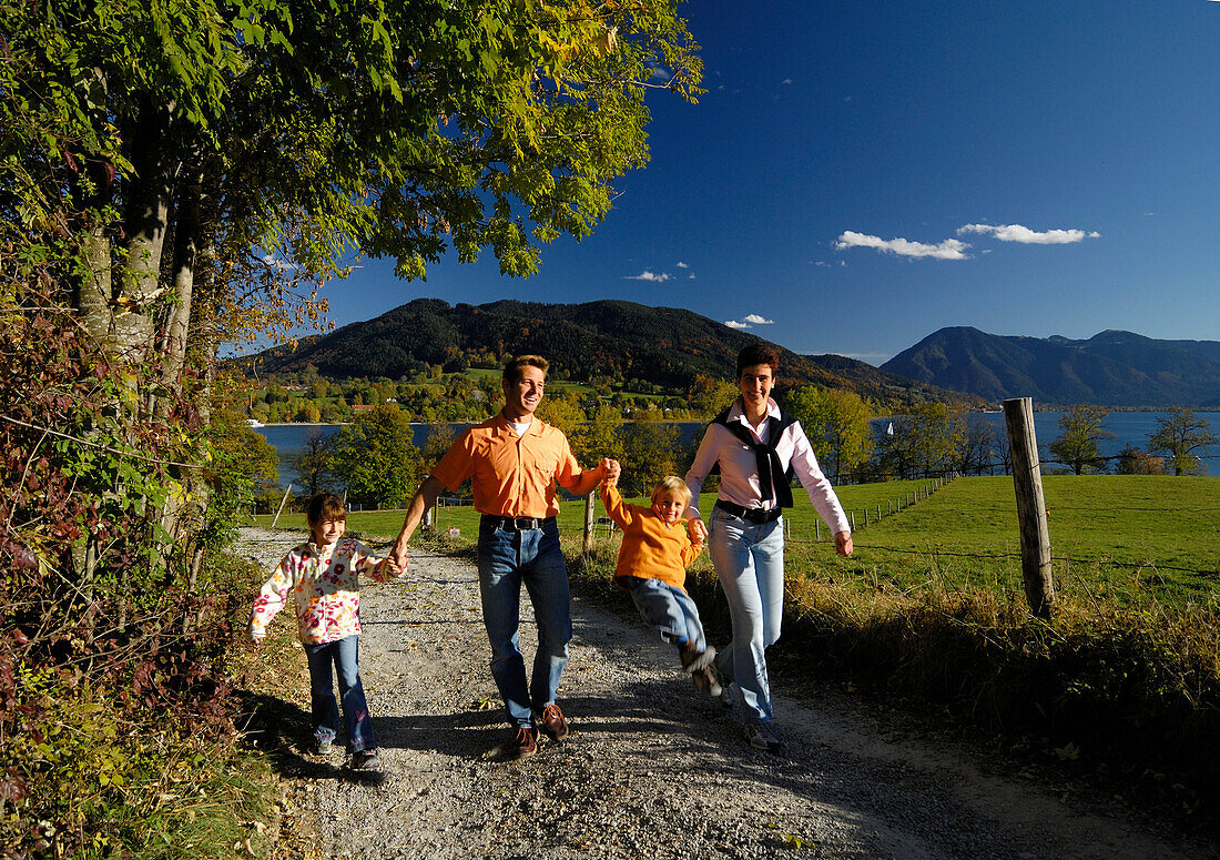 Family hiking at Lake Tegernsee, Hand in Hand, Upper Bavaria, Bavaria, Germany, Europe