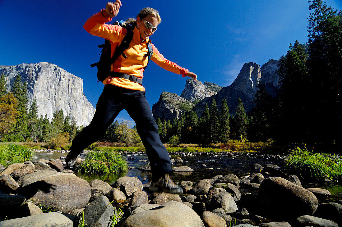 Mid adult woman jumping, Yosemite National Park, California, USA