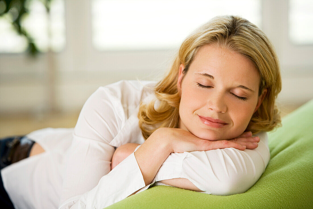 Woman relaxing with eyes closed